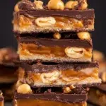 Homemade Snickers Bars: A Delicious Sweet Treat 9 Delicious Homemade Snickers Bars on a Plate